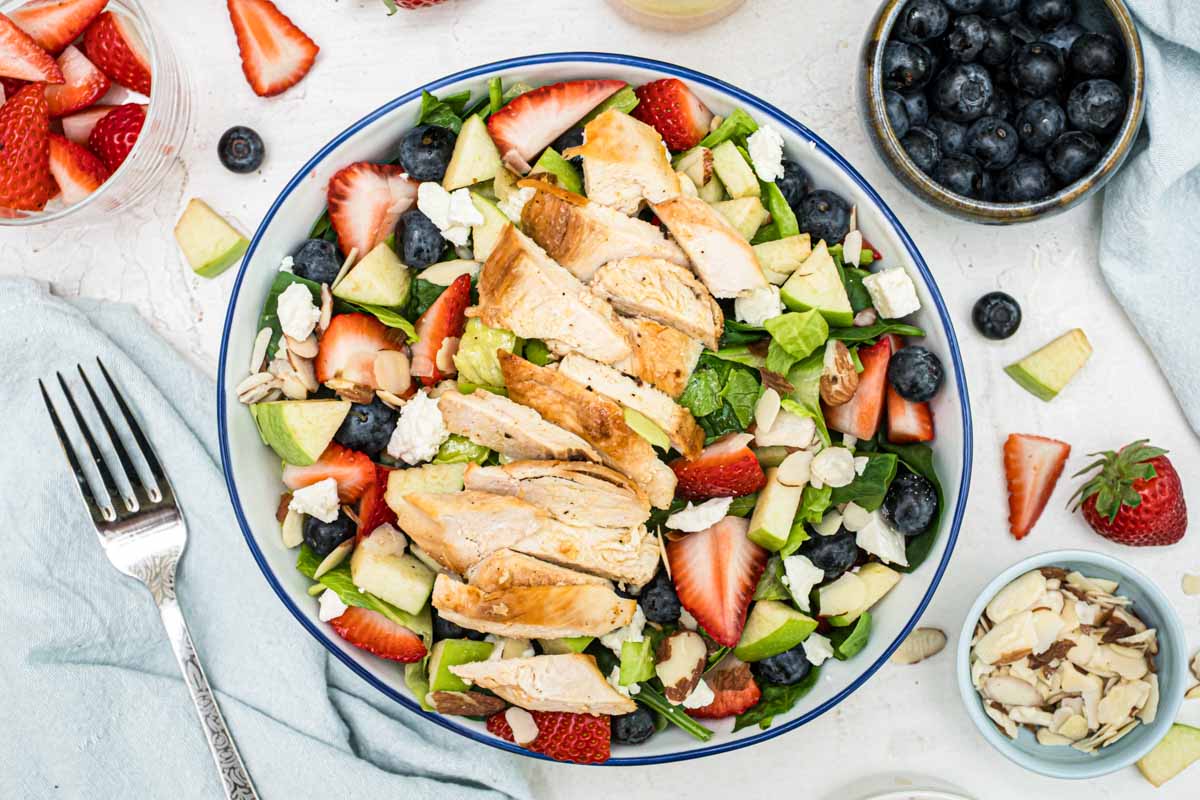 A large bowl with the chick-fil-A market salad and a fork.