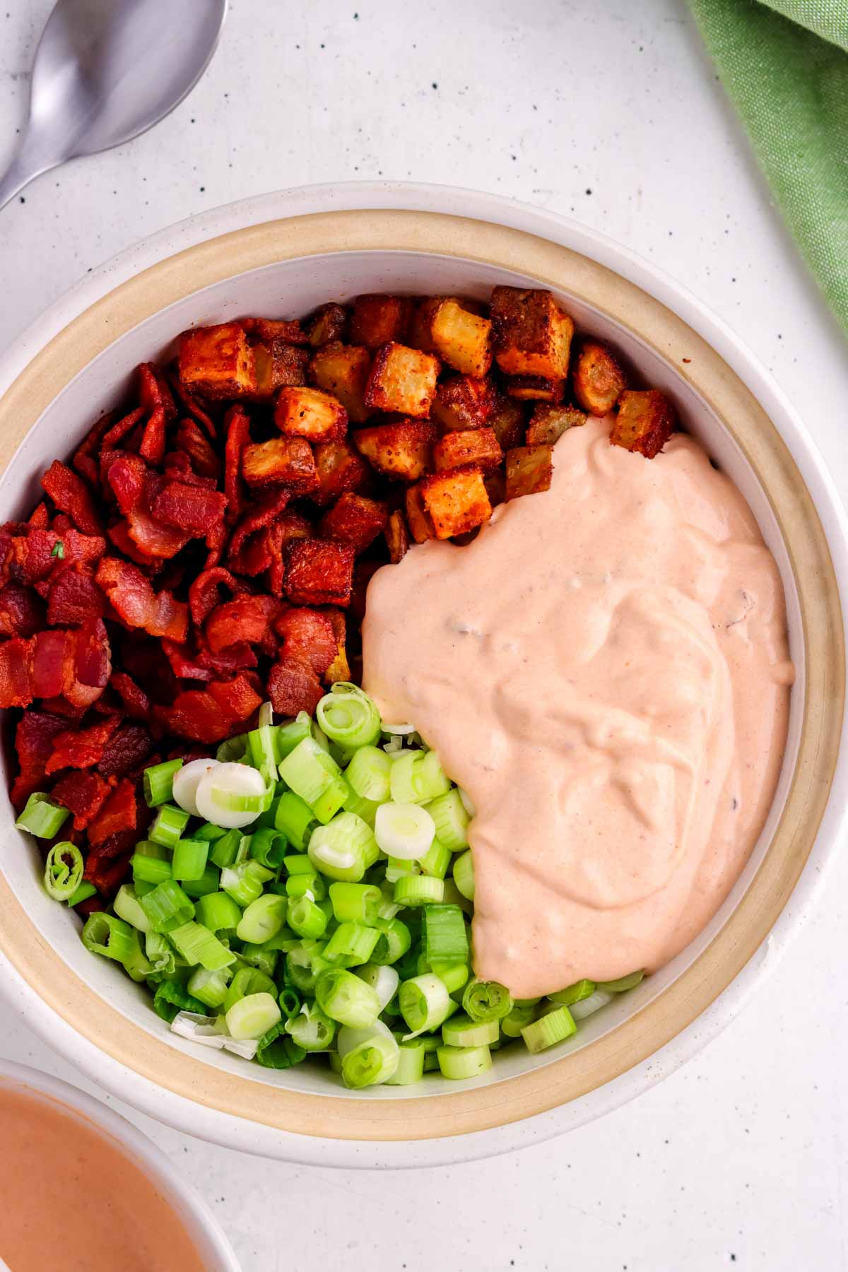 Ingredients for chipotle potato salad in a bowl before being mixed.