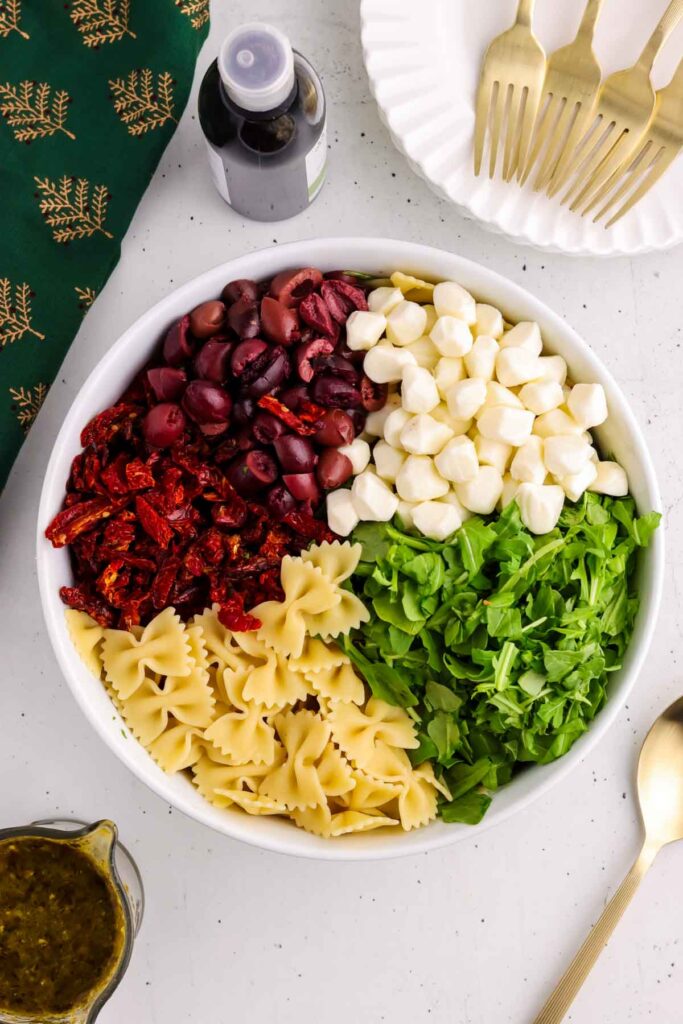All ingredients for the xmas pasta salad in a bowl before being tossed with the dressing.