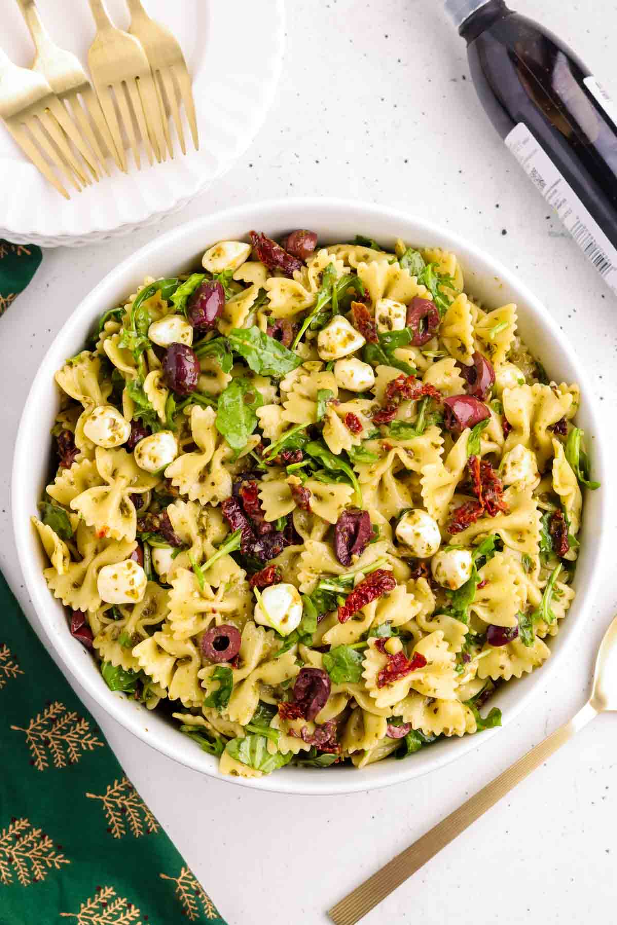 Christmas pasta salad in white serving bowl.