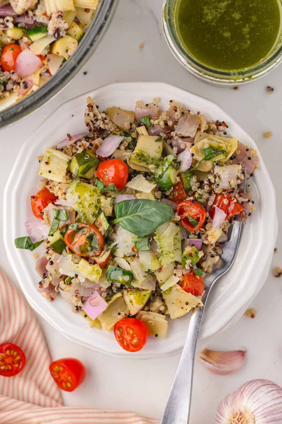 Quinoa salad with roasted vegetables on a plate.