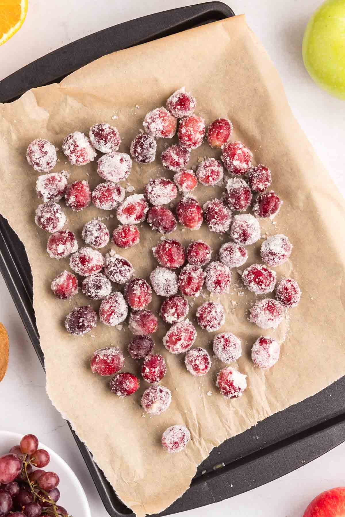 Sugared grapes on a baking sheet.