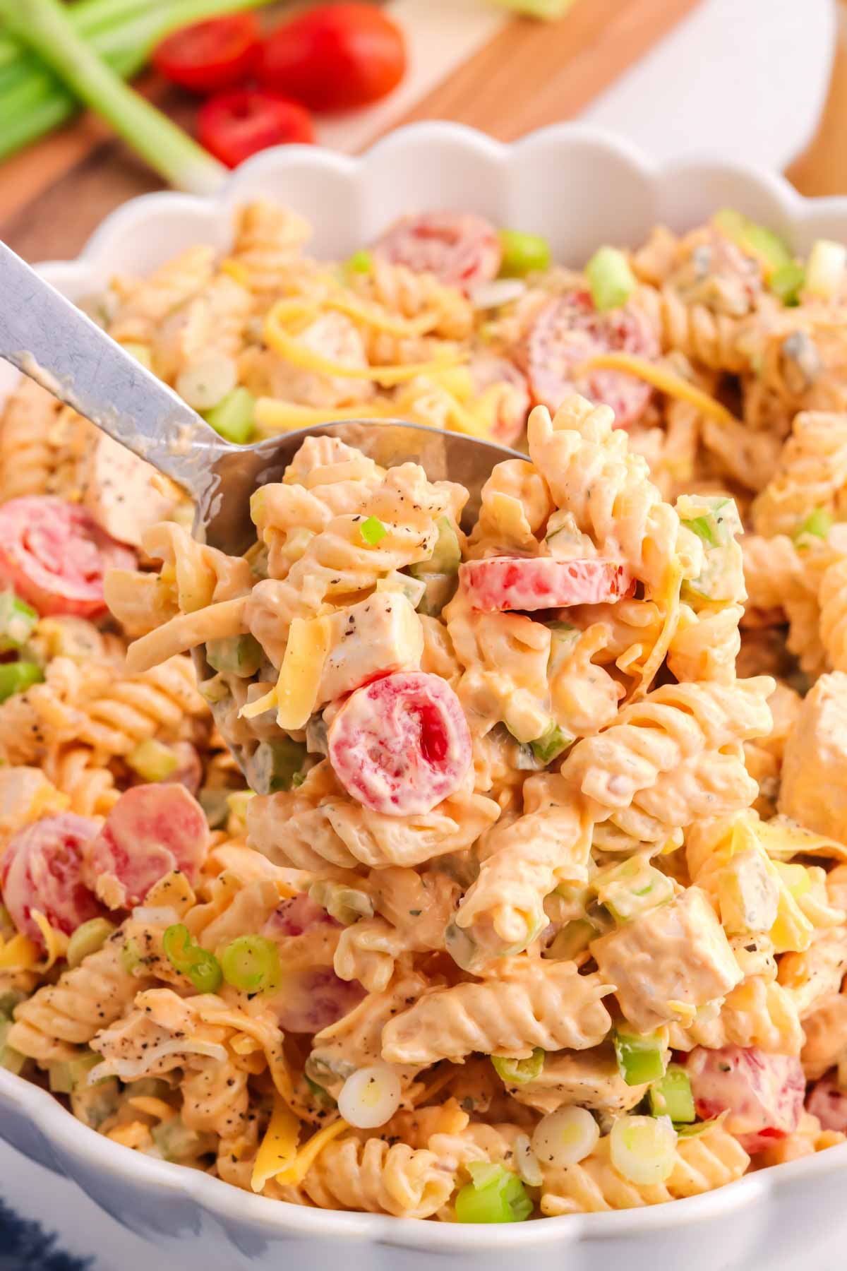 Buffalo chicken pasta salad on a spoon.