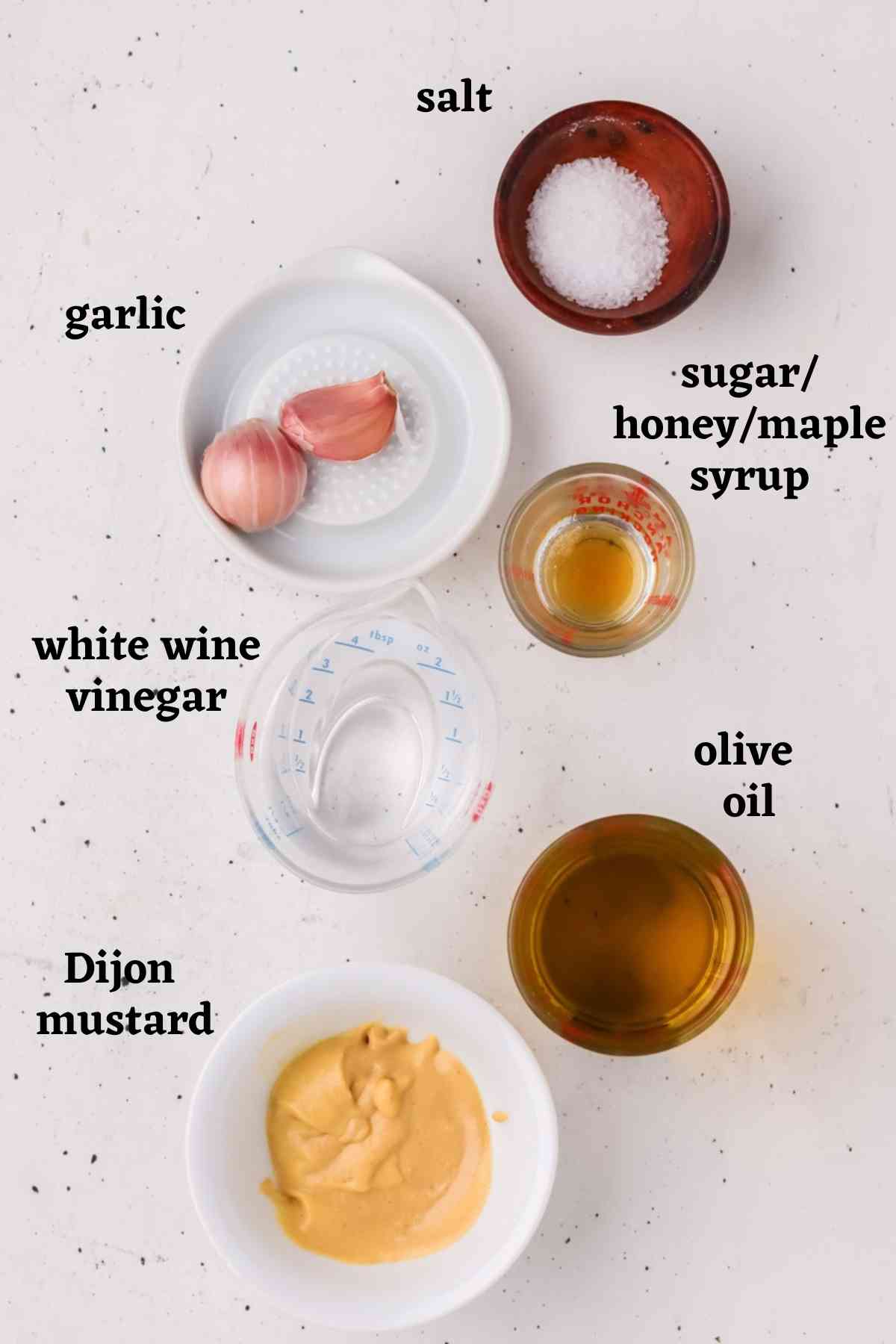 Ingredients needed to make easy Dijon vinaigrette salad dressing.