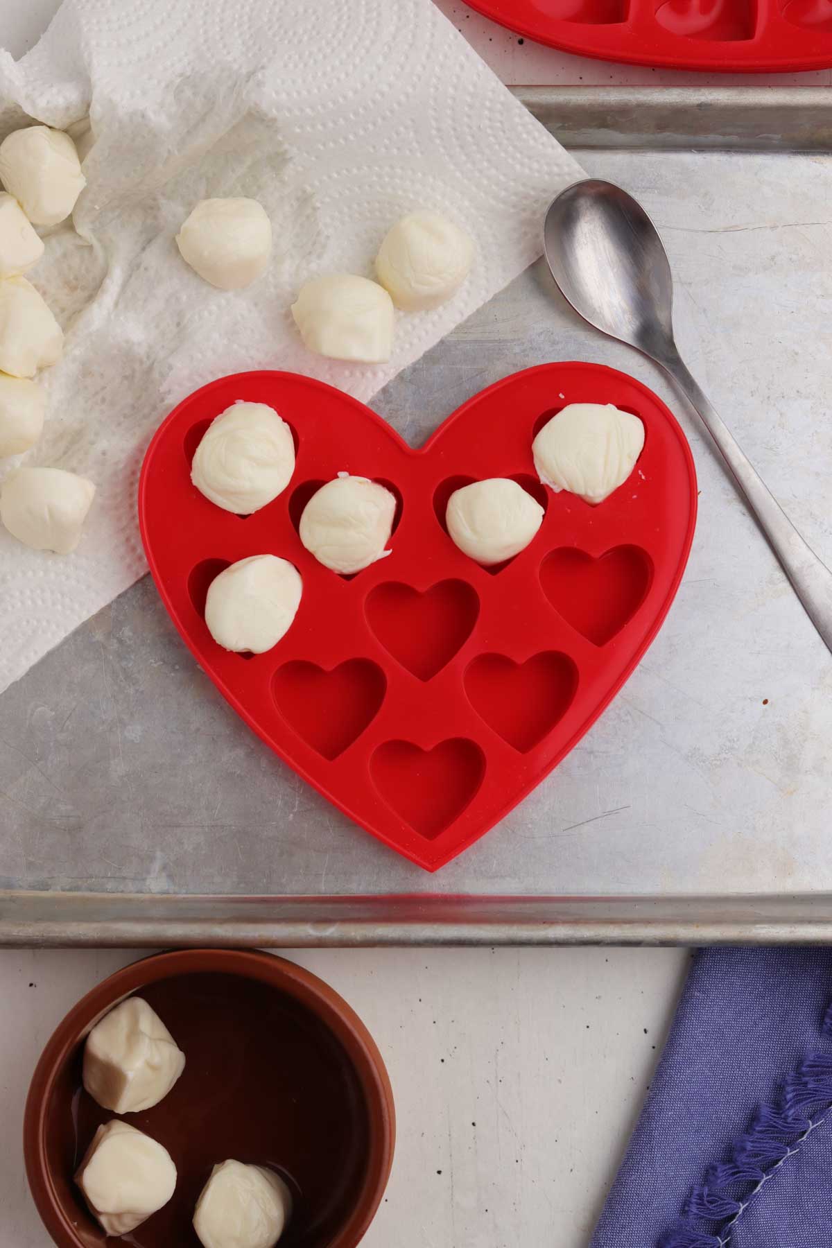 Mozzarella balls in the molds before being baked.